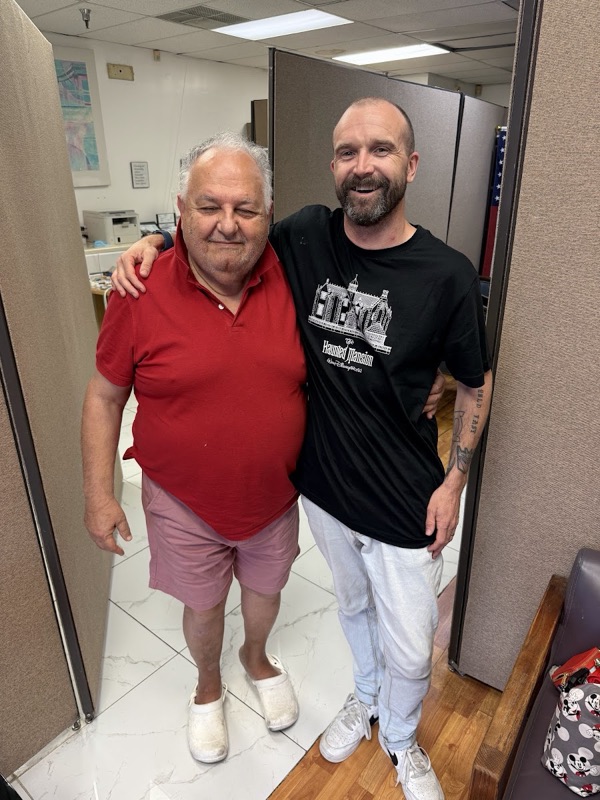 A patient with Dr. Sidawi after emergency treatment during a Disney vacation